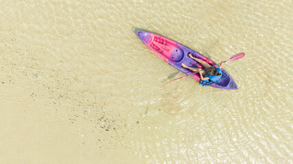 Aerial view of a kayak in the blue sea .man kayaking he does water sports activities