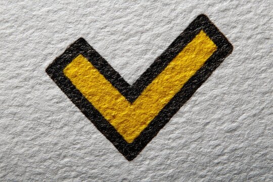 Yellow checkmark on textured surface
