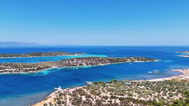 4k drone video of Garip and Kalem islands with turquoise sea and coral reefs in Bademli. Dikili, a district of Izmir famous for its turquoise sea in Turkiye.