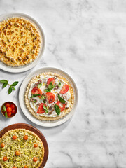 Three tarts on a marble surface