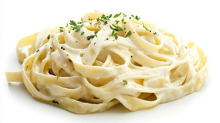 Creamy Alfredo fettuccine pasta topped with fresh herbs isolated