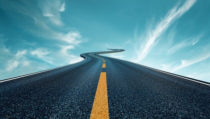 Winding asphalt road with yellow dashed line ascending into blue sky with clouds
