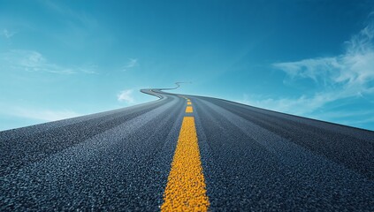 Fototapeta premium Winding asphalt road with yellow dashed line ascending into blue sky
