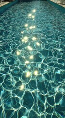 Sunlit turquoise pool water, gentle ripples, creating a textured surface