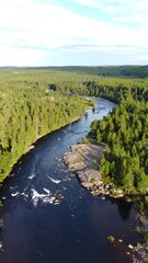 Fototapeta premium Aerial View of River Bend in Forest