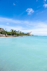  view of Waikiki Beach, Honolulu, Hawaii, with vibrant sunset skies, turquoise waters, and beachfront hotels. Perfect for travel, vacation, tourism, and real estate marketing content.