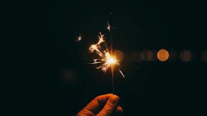 Hand Holding a Glowing Sparkler at Night Celebration - Powered by Adobe