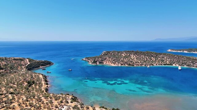 4k drone video of Garip and Kalem islands with turquoise sea and coral reefs in Bademli. Dikili, a district of Izmir famous for its turquoise sea in Turkiye.