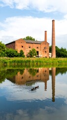 Obraz premium Brick Factory Reflection in Canal
