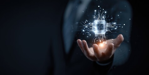 A person in a suit holds a holographic circuit board