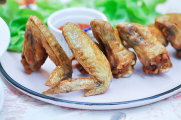 chicken wings or deep fried chicken , fried chicken and sauce