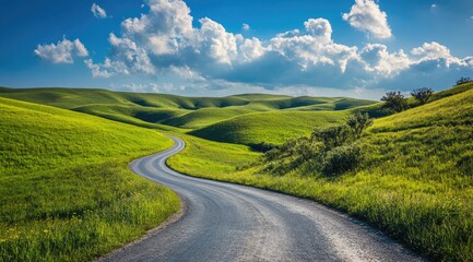 Winding road through verdant hills under a vibrant sky