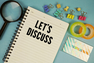 Let's Discuss text with magnifying glass on blue background