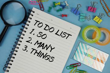 So Many Things in To Do List text with magnifying glass on blue background