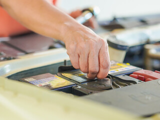 Close up technician hands at work repair car in garage at house holiday. Person activity family home for concept mechanical, transportation, working family. Mothers at home. Technician fix vehicle 