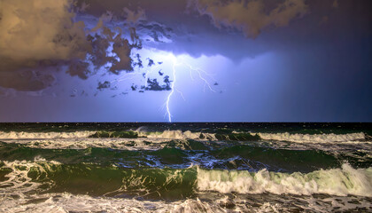 Lightning strikes over ocean waves under a dark cloudy sky at night.