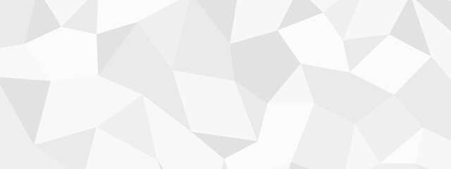 Obraz premium A clean, abstract polygonal background in various shades of white and light gray, featuring a geometric, crystalline pattern.