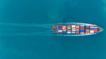 Aerial of cargo ship carrying container and running verry fast for export cargo from cargo yard...