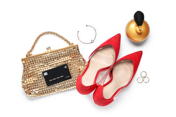 Female shoes with handbag, credit card and accessories on white background