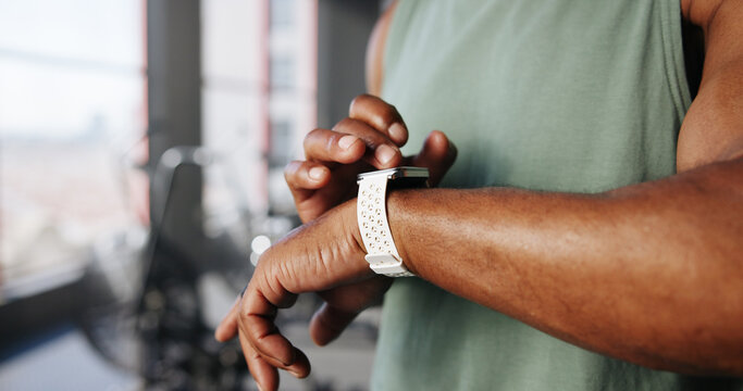 Smart watch, fitness and hands of man in gym for tracking exercise, training and workout progress. Sports, recovery and person with digital tech for wellness app, performance and stats for health