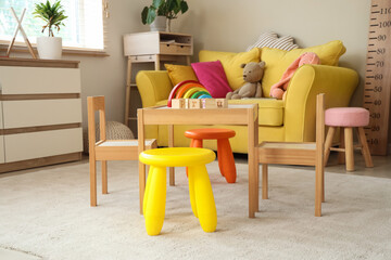 Interior of modern playroom with toys in kindergarten