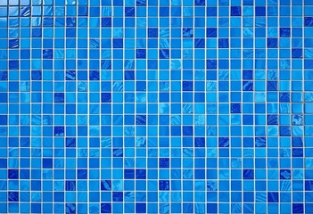 A wall covered in various shades of blue tiles, creating a textured background,  interior design,  wall