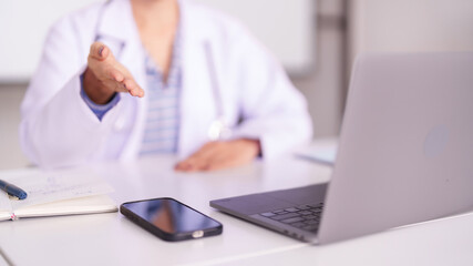 Medical Professional Hand Reaching Desk Laptop Technology Healthcare Consultation Doctor Office Clinic Setting Digital Communication Service