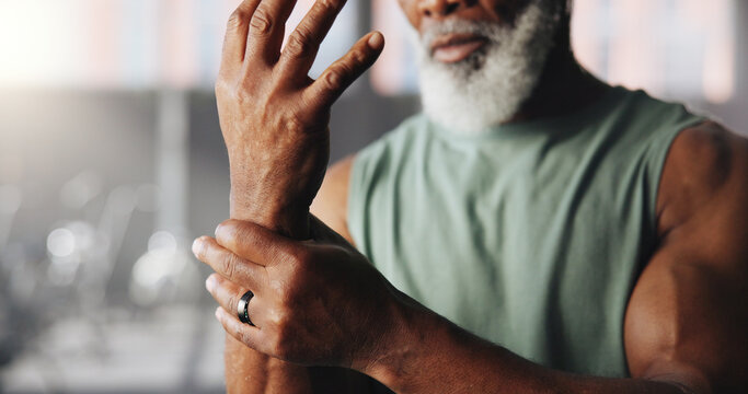 Fitness, injury and man with wrist pain in gym for muscle fatigue, inflammation or training accident. Sports center, hands and person with sprain, hurt and tendinitis for exercise, workout and health