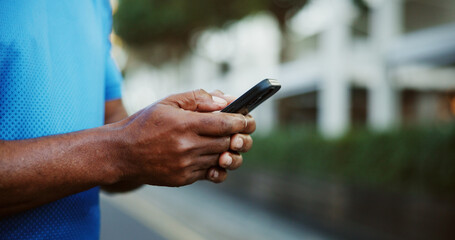 Hands, typing and athlete with smartphone, outdoor and tracking fitness progress on website and app. Research, tips and searching for workout program, space and person with mobile for training plan