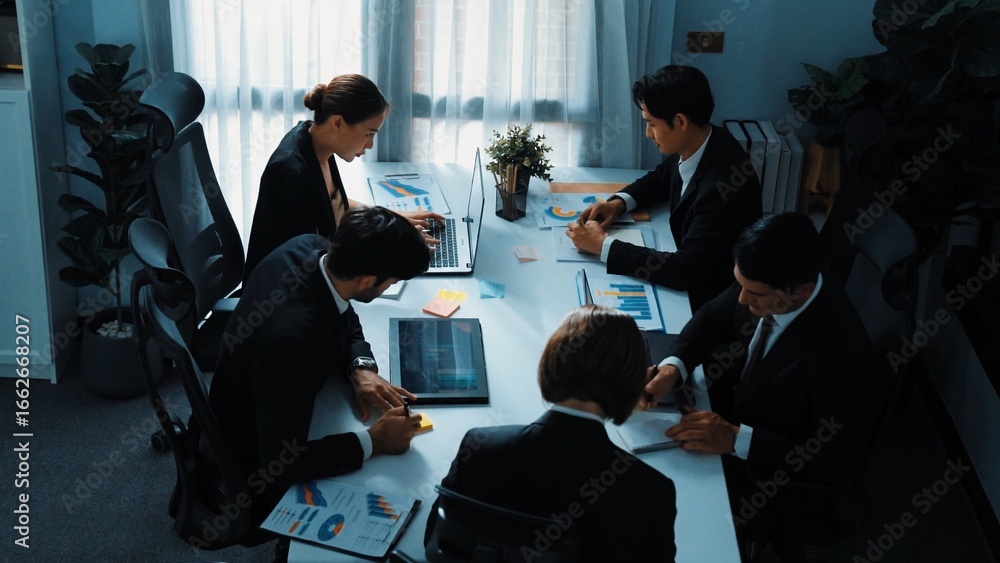Aufkleber top view of business people working together to analysis stock market data while sitting at meeting 