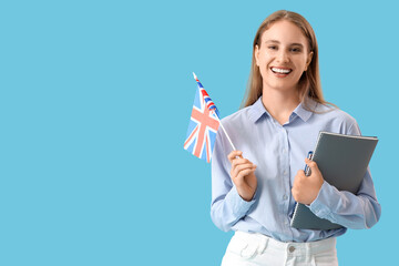 Female English teacher with UK flag and notebooks on blue background