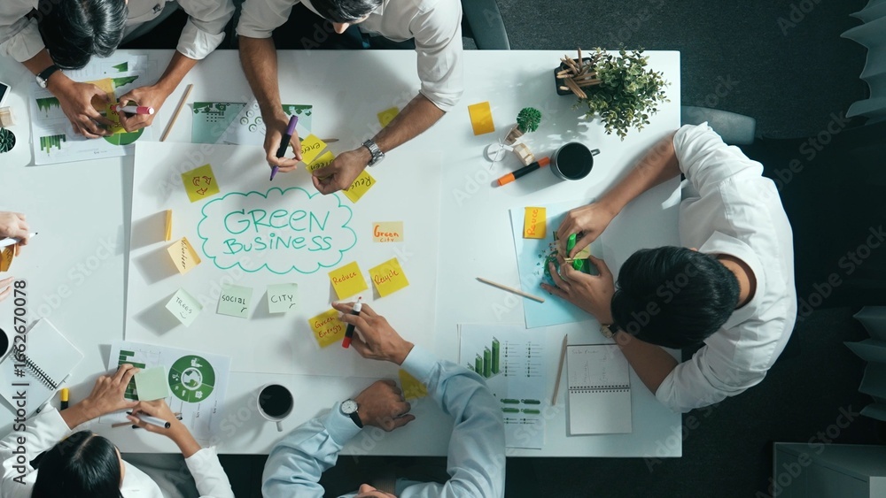 Poster top view of professional business team working together to brainstorm environmental idea by using mi