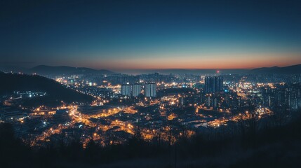 Obraz premium City skyline at dawn, illuminated with lights