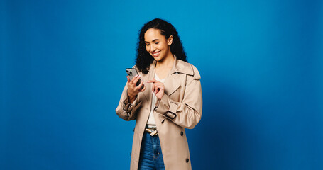 Phone, app and typing with woman in studio for connection, text message and social media. Online...