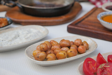 Delicious dish of chickpeas served with spices and sauces