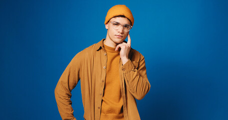 Man, portrait and student thinking in studio for exam inspiration, problem solving or academic...