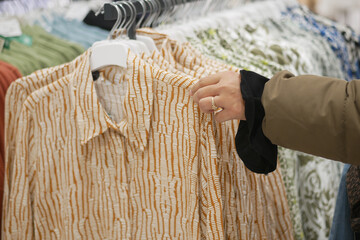 Shopping for stylish shirts in a clothing store