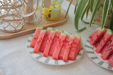 Freshly sliced watermelon served on a patterned plate