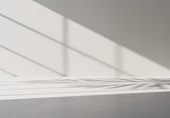 Obraz premium Mockup sunlight casting diagonal shadows on a clean, minimalist wall commercial usage