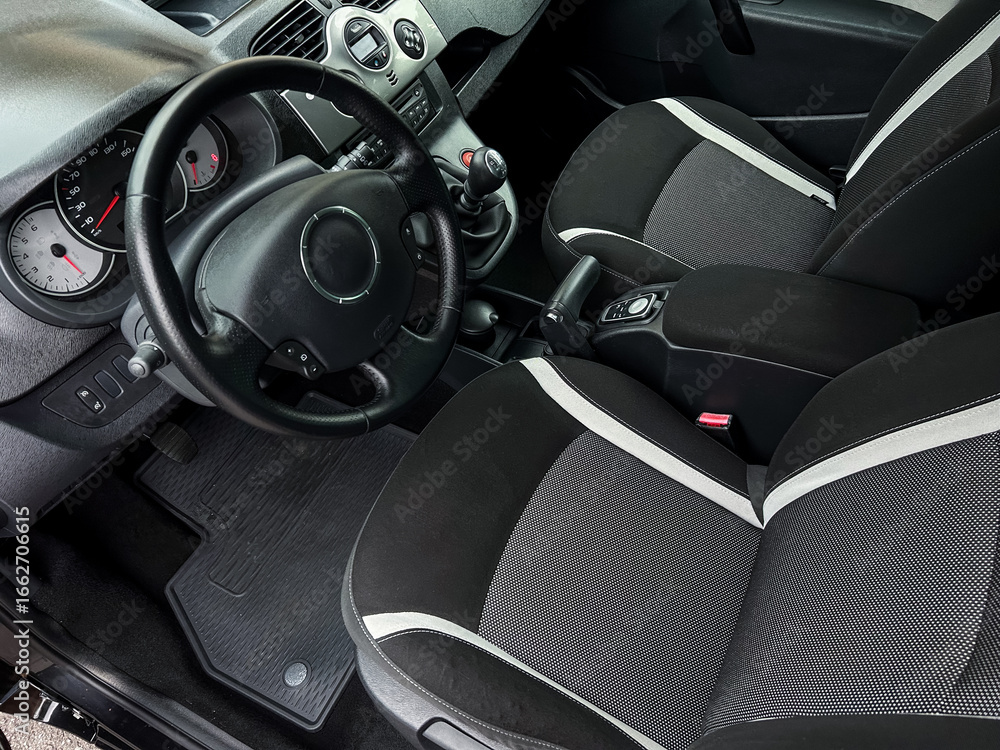 Poster the car interior boasts a stylish design with comfortable seating and an elegant dashboard that high