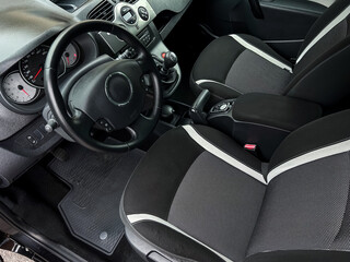 The car interior boasts a stylish design with comfortable seating and an elegant dashboard that...