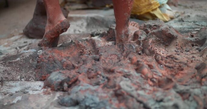 Indian Clay Artist: Preparing Clay with Feet for Ganesh Idol Making