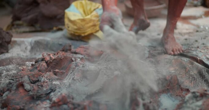Indian Clay Artist: Preparing Clay with Feet for Ganesh Idol Making