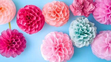 Colorful Paper Pom Poms on Blue Background Party Decoration