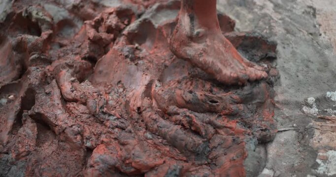 Indian Clay Artist: Preparing Clay with Feet for Ganesh Idol Making