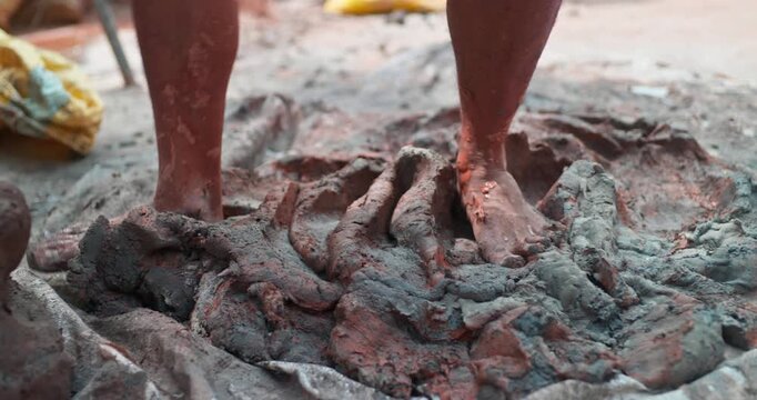 Indian Clay Artist: Preparing Clay with Feet for Ganesh Idol Making
