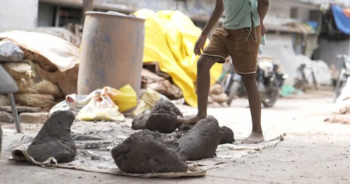 Indian Clay Artist: Preparing Clay with Feet for Ganesh Idol Making