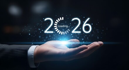 Hand Holding 2026 Loading Symbol with Futuristic Technology Background