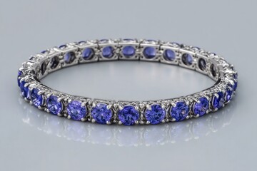 Beautiful tanzanite bracelet shining on reflective surface
