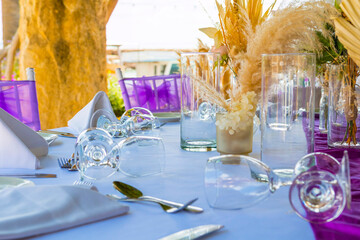 Traditional Greek restaurant in Paphos, Cyprus — whitewashed walls, blue accents, and blooming flowers set the scene for delicious local cuisine in a charming Mediterranean atmosphere.
